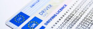 A close-up image of a UK driving licence necessary for an International Driving License in Thailand with European Union markings, featuring a detailed security code pattern.