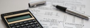 Calculator and financial documents illustrating Thailand investment opportunities