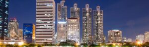 Night skyline of Bangkok’s skyscrapers, symbolizing the dynamism of business law in Thailand.