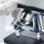 Close-up of microscope in a lab, representing research activity in a biotech company Thailand.