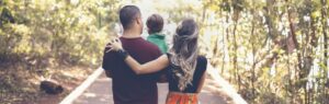 Family holding hands with their child, illustrating the process of obtaining a Thailand DTV visa to move together as a family.