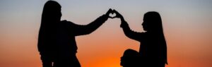 Family Visa in Thailand: Heart-shaped silhouette at sunset.
