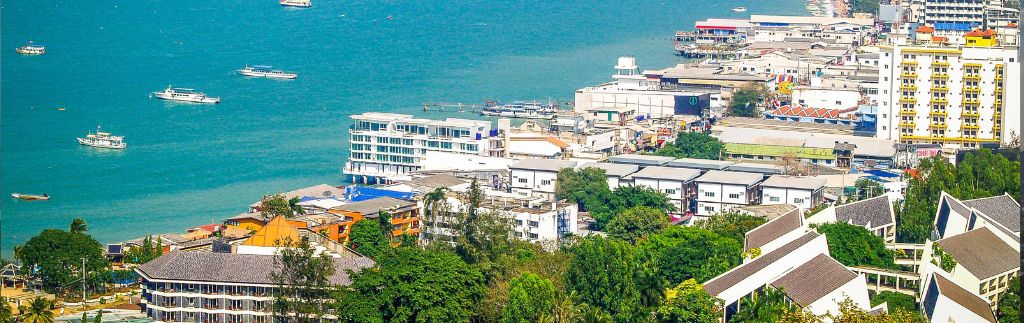 Aerial view of Hua Hin coastline with residential and commercial buildings – ideal area to buy house Hua Hin