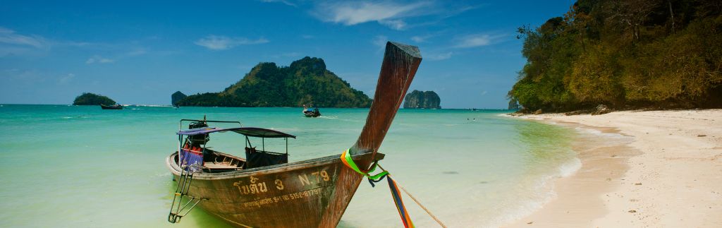 Aerial view of beachfront villas and coastline, illustrating real estate in Krabi
