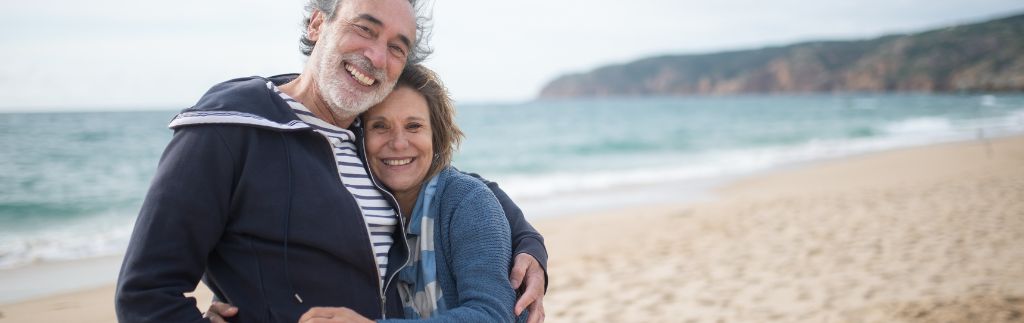 Happy senior couple enjoying retirement in Pattaya on the beach