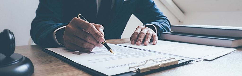 Lawyer signing visa cancellation documents in Thailand.