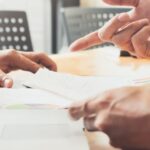 Business meeting and legal consultation illustrating company restructuration in Thailand and corporate decision-making processes