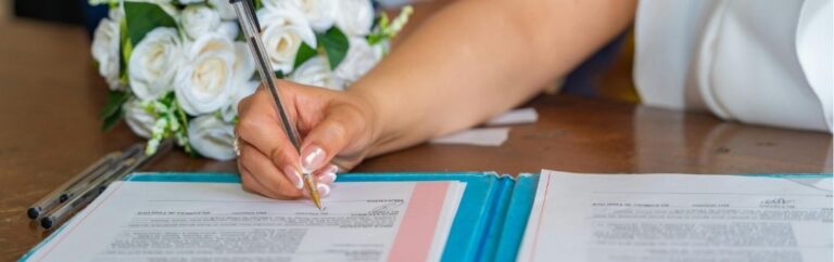 Foreign spouse signing official marriage documents in Thailand for a marriage visa application
