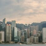 A panoramic view of the Hong Kong skyline, symbolizing modern business and finance in the context of the Hong Kong Tax System.