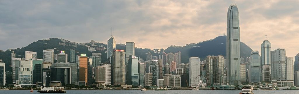A panoramic view of the Hong Kong skyline, symbolizing modern business and finance in the context of the Hong Kong Tax System.