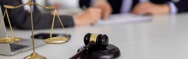 Administrative litigation and appeals in Thailand – judge's gavel and scales of justice on a lawyer's desk