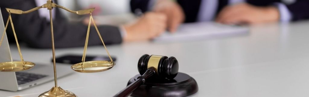 Administrative litigation and appeals in Thailand – judge's gavel and scales of justice on a lawyer's desk