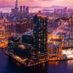 Skyline di Hong Kong al tramonto che illustra l’ambiente economico e il sistema di tasse Hong Kong per le imprese internazionali