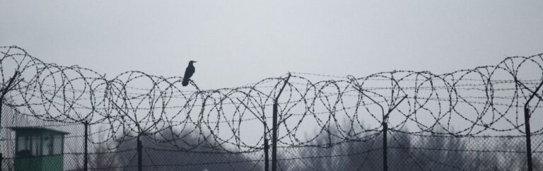 Arrested in Thailand: prison fence and legal consequences following an arrest in Thailand.