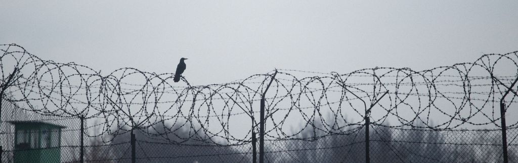 Arrested in Thailand: prison fence and legal consequences following an arrest in Thailand.