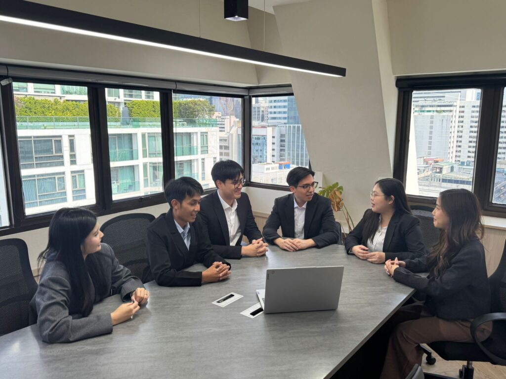 Lawyers working together during a meeting at Benoit & Partners international law firm in Bangkok