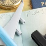 Passport, visa stamp, airplane model and travel documents illustrating Thailand visa crackdown and stricter airport immigration checks.