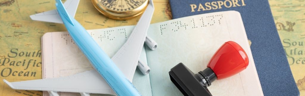 Passport, visa stamp, airplane model and travel documents illustrating Thailand visa crackdown and stricter airport immigration checks.