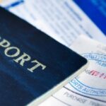 Passport and immigration documents illustrating Thailand overstay blacklist consequences for foreign travelers